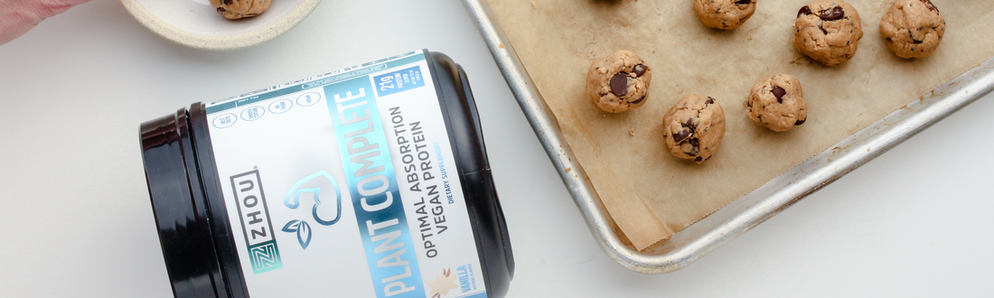 Zhou Plant Complete Protein next to a tray and bowl of protein bites.