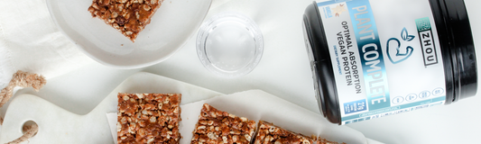 Plant Complete next to a tray and plate with puffed rice snacks
