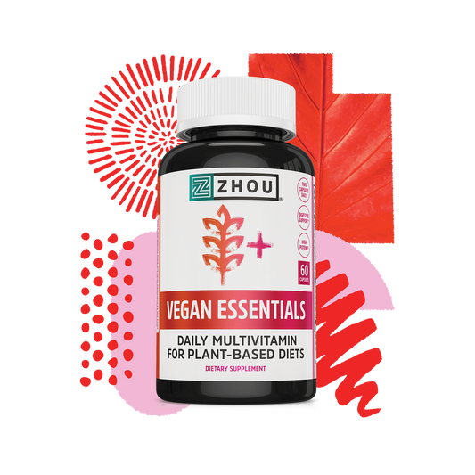 A bottle of Zhou Nutrition Vegan Essentials multivitamin with red abstract shapes and a leaf in the background.